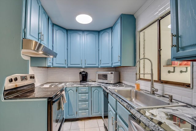kitchen featuring blue cabinetry and electric stove