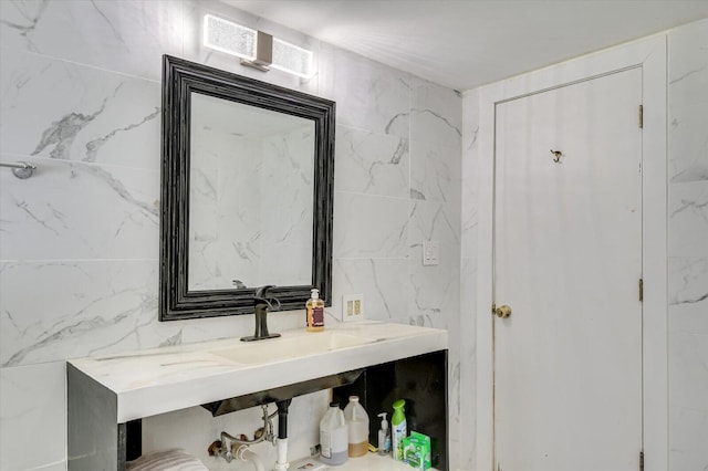 bathroom with tile walls