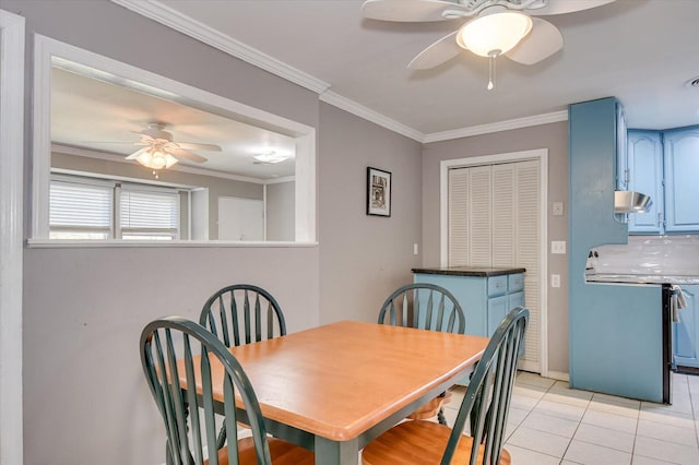 dining area with light tile patterned floors, ornamental molding, and a ceiling fan