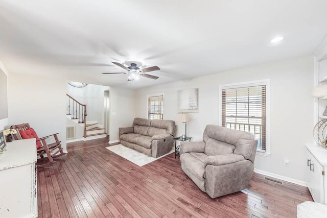 living room with ceiling fan, a healthy amount of sunlight, and hardwood / wood-style floors