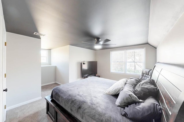 carpeted bedroom with ceiling fan and lofted ceiling