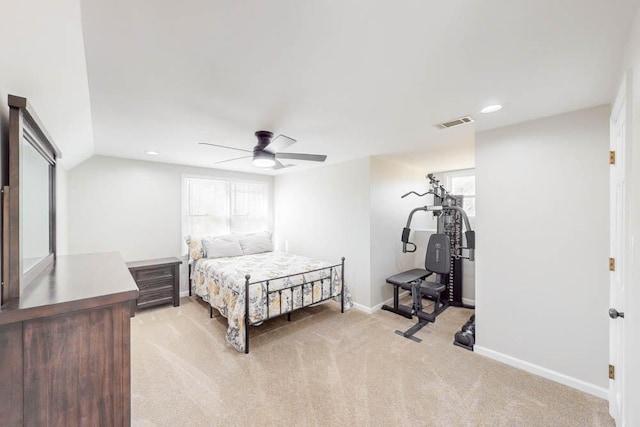 bedroom featuring vaulted ceiling, light carpet, and ceiling fan