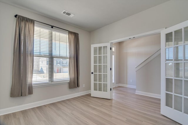 610 Turtle Crk Ln, Harlem, GA 30814 - spare room with light wood-style flooring, plenty of natural light, french doors, and baseboards