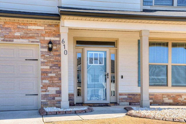 610 Turtle Crk Ln, Harlem, GA 30814 - view of exterior entry featuring a garage, stone siding, and brick siding