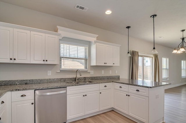 610 Turtle Crk Ln, Harlem, GA 30814 - kitchen featuring dishwasher, a sink, a peninsula, light wood-style floors, and white cabinetry