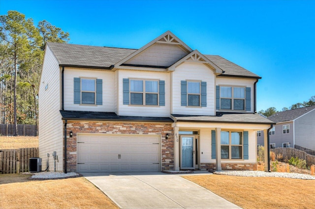 610 Turtle Crk Ln, Harlem, GA 30814 - craftsman inspired home with fence, an attached garage, driveway, central AC, and stone siding