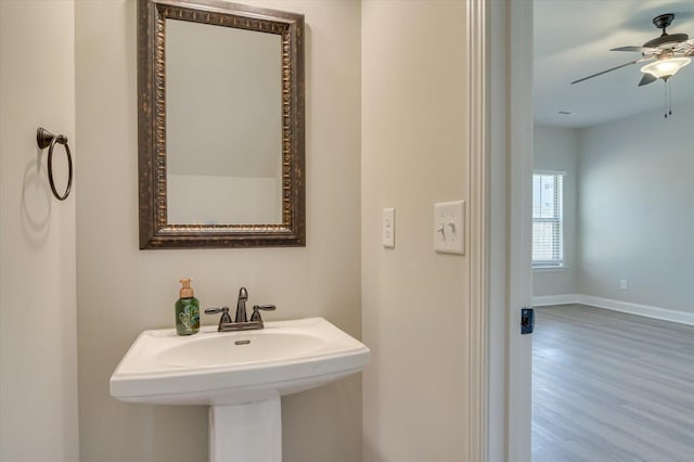 610 Turtle Crk Ln, Harlem, GA 30814 - bathroom featuring a ceiling fan, wood finished floors, baseboards, and a sink