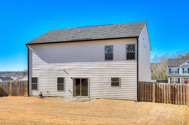 610 Turtle Crk Ln, Harlem, GA 30814 - back of house featuring a fenced backyard, a patio area, and roof with shingles