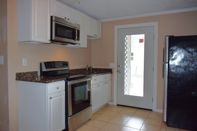 1443 Spring Hill Ter, Augusta, GA 30904 - kitchen with white cabinets, a wealth of natural light, and stainless steel appliances