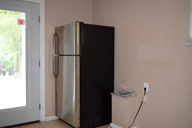 1443 Spring Hill Ter, Augusta, GA 30904 - interior space with light tile patterned floors, baseboards, and freestanding refrigerator