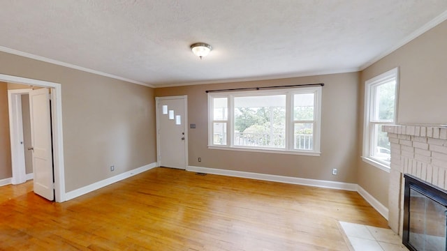 1443 Spring Hill Ter, Augusta, GA 30904 - entryway with a healthy amount of sunlight, baseboards, crown molding, and light wood-type flooring