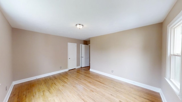 1443 Spring Hill Ter, Augusta, GA 30904 - empty room with baseboards, plenty of natural light, and light wood-style flooring