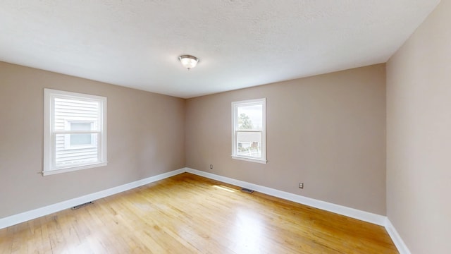 1443 Spring Hill Ter, Augusta, GA 30904 - empty room with baseboards, visible vents, and light wood finished floors