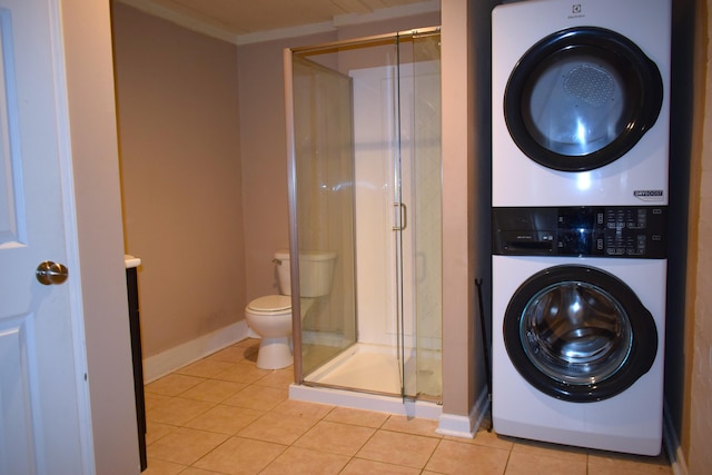 1443 Spring Hill Ter, Augusta, GA 30904 - laundry room featuring light tile patterned floors, crown molding, laundry area, and stacked washer / dryer