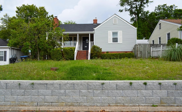 1443 Spring Hill Ter, Augusta, GA 30904 - view of front of property with fence, covered porch, a chimney, and stairs
