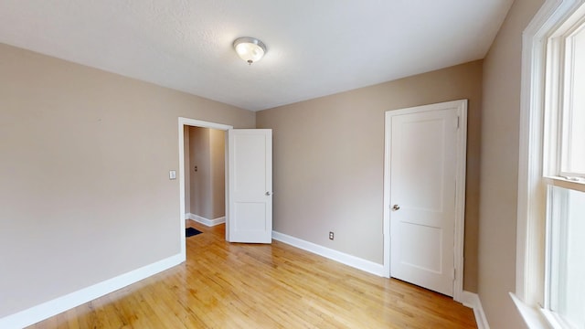 1443 Spring Hill Ter, Augusta, GA 30904 - unfurnished bedroom with light wood-style floors and baseboards