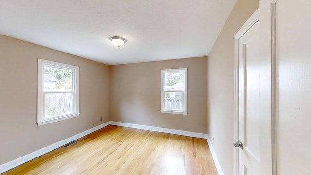 1443 Spring Hill Ter, Augusta, GA 30904 - unfurnished room with baseboards, visible vents, and light wood finished floors