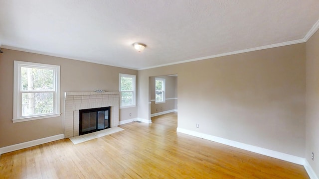 1443 Spring Hill Ter, Augusta, GA 30904 - unfurnished living room with baseboards, ornamental molding, and light wood-style flooring