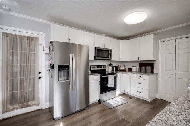 kitchen featuring stainless steel appliances, white cabinetry, light stone counters, and a textured ceiling