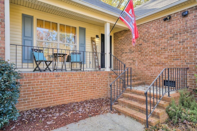 entrance to property featuring a porch