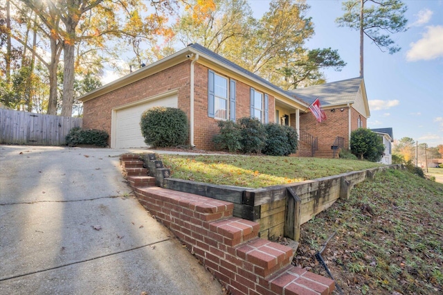 view of side of property featuring a garage