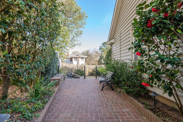 view of patio featuring fence