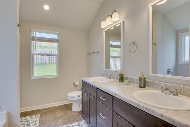 2613 Inverness Dr, Hephzibah, GA 30815 - full bathroom with vaulted ceiling and double vanity