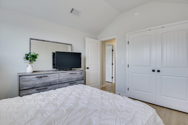 2613 Inverness Dr, Hephzibah, GA 30815 - bedroom featuring vaulted ceiling, wood finished floors, and a closet
