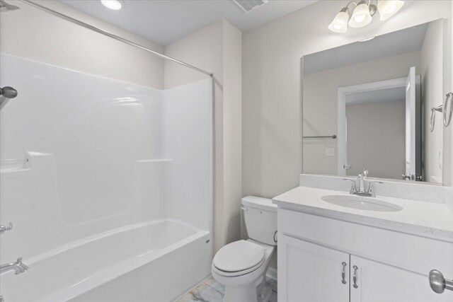 full bathroom featuring shower / washtub combination, vanity, and toilet