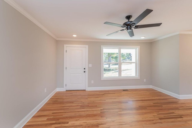 unfurnished room featuring light hardwood / wood-style floors, ceiling fan, and ornamental molding