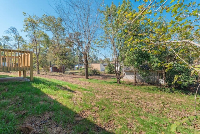 view of yard featuring a wooden deck