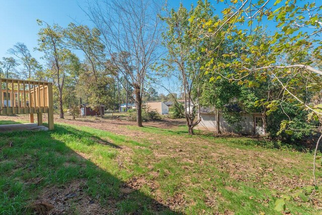 view of yard featuring a wooden deck