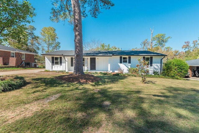 single story home with cooling unit and a front lawn