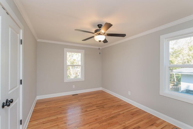 spare room featuring ceiling fan, light hardwood / wood-style flooring, and ornamental molding