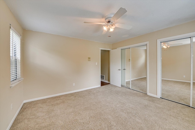 2979 Foxhall Cir, Augusta, GA 30907 - unfurnished bedroom featuring two closets, carpet flooring, and baseboards