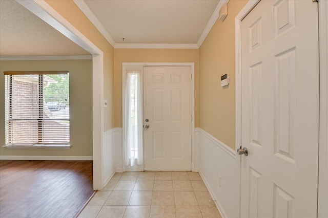 2979 Foxhall Cir, Augusta, GA 30907 - entrance foyer with light tile patterned floors, ornamental molding, and wainscoting