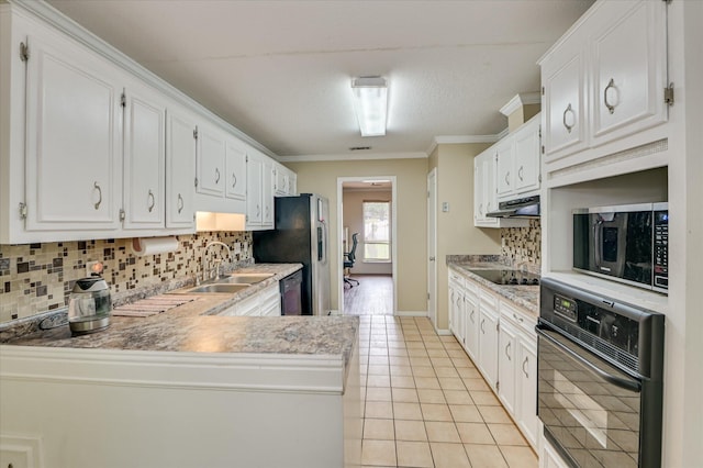 2979 Foxhall Cir, Augusta, GA 30907 - kitchen featuring tasteful backsplash, a sink, light tile patterned floors, black appliances, and under cabinet range hood