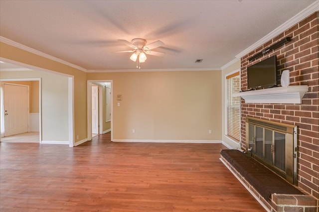 2979 Foxhall Cir, Augusta, GA 30907 - unfurnished living room featuring ornamental molding, a brick fireplace, ceiling fan, and wood finished floors