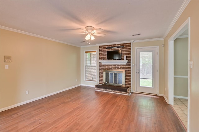 2979 Foxhall Cir, Augusta, GA 30907 - unfurnished living room featuring ornamental molding, ceiling fan, wood finished floors, and a fireplace