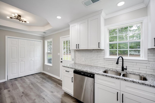 1178 Huntly Cir, Thomson, GA 30824 - kitchen featuring stainless steel dishwasher, tasteful backsplash, crown molding, white cabinetry, and recessed lighting