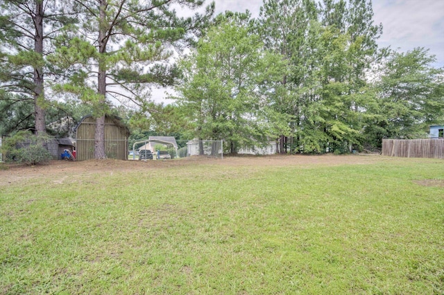 1178 Huntly Cir, Thomson, GA 30824 - view of yard with an outbuilding and a carport