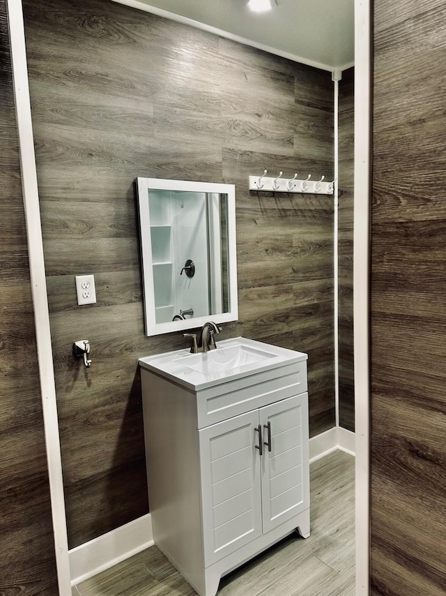 bathroom featuring vanity and hardwood / wood-style floors