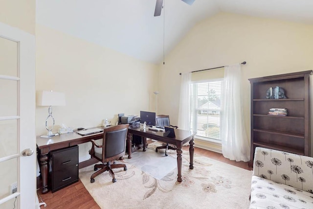 office with lofted ceiling, wood finished floors, and a ceiling fan