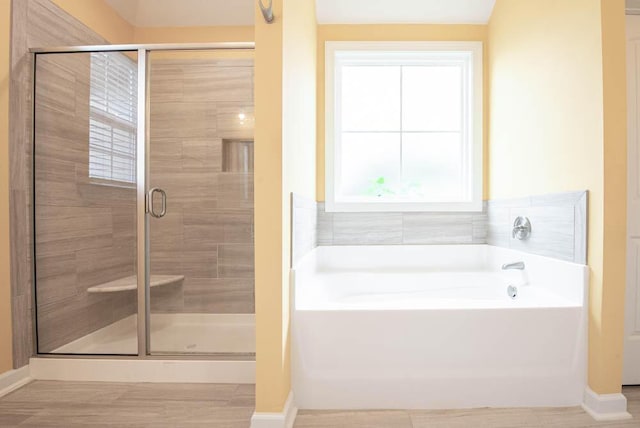 1190 Tralee Dr, Beech Island, SC 29842 - full bathroom with a garden tub, a stall shower, and wood finished floors