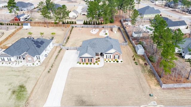 birds eye view of property with a residential view