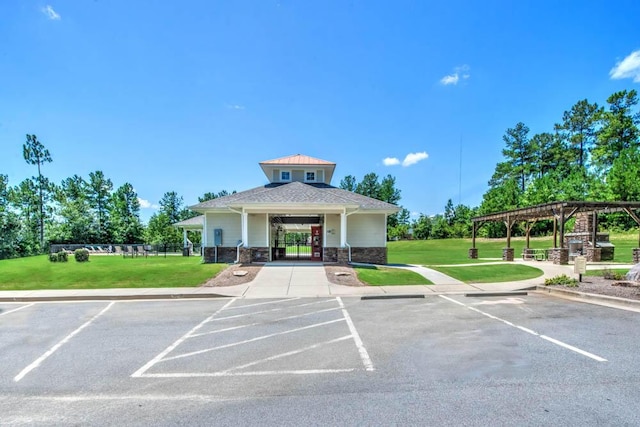 view of property featuring uncovered parking