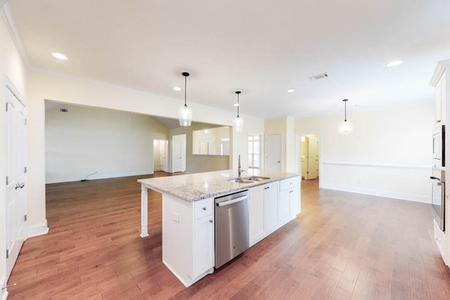 1190 Tralee Dr, Beech Island, SC 29842 - kitchen with stainless steel dishwasher, white cabinets, light wood-style floors, an island with sink, and open floor plan