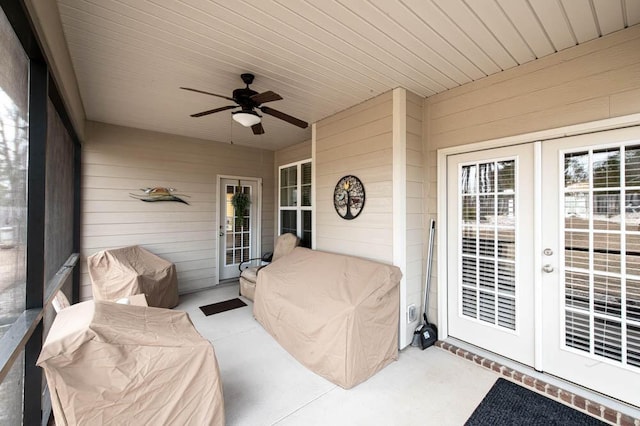 sunroom with french doors, ceiling fan, and wooden ceiling