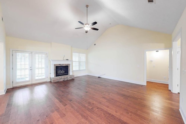 1190 Tralee Dr, Beech Island, SC 29842 - unfurnished living room featuring a ceiling fan, hardwood / wood-style flooring, a brick fireplace, and high vaulted ceiling