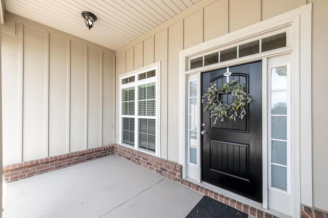 1190 Tralee Dr, Beech Island, SC 29842 - view of exterior entry featuring board and batten siding, brick siding, and a porch